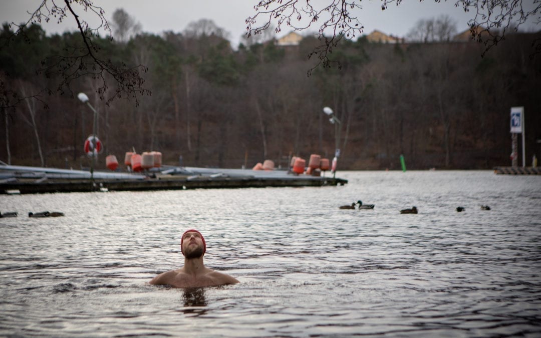 Ice swimming. Person in cold water.